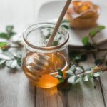 clear glass jar with honey